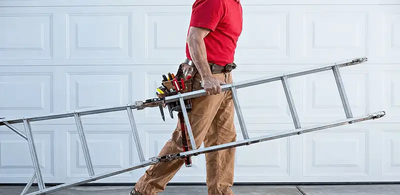 Garage door repair technician arriving with tools and ladder in Syracuse, NY